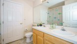 Family bathroom with bath & shower over - www.iwantavilla.com is the best in Orlando vacation Villa rentals