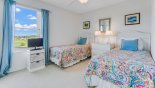 Monticello 1 Villa rental near Disney with Bedroom #3 with twin beds, LCD TV and views over pool deck & golf course beyond