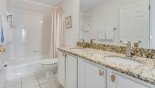 Villa rentals in Orlando, check out the Family bathroom #3 with bath & shower over, his & hers sinks and WC