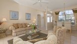 Living room viewed towards entrance foyer and dining area with this Orlando Villa for rent direct from owner