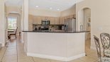 View of kitchen from family room - arched opening on left leads to dining room from Palm Beach 1 Villa for rent in Orlando