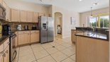 Spacious rental Highlands Reserve Villa in Orlando complete with stunning Fully fitted kitchen with island unit including sink with waste disposal & dishwasher