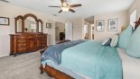 Villa rentals in Orlando, check out the Master bedroom #1 with large dresser & mirror above