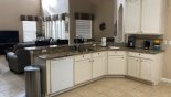Spacious rental Highlands Reserve Villa in Orlando complete with stunning Kitchen viewed towards family room
