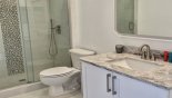 Jack & Jill bathroom #2 with walk-in shower, single vanity & WC - shared with movie den from Highlands Reserve rental Villa direct from owner