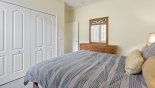 Villa rentals near Disney direct with owner, check out the Ground floor bedroom #5 with double built-in closet and dresser with mirror
