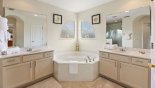 Master #1 ensuite bathroom with corner bath, walk-in shower. his & hers sinks & separate WC from Highlands Reserve rental Villa direct from owner