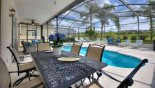 Villa rentals in Orlando, check out the Patio table with 6 chairs under covered lanai - ideal for alfresco dining