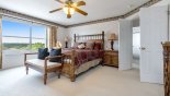Master bedroom with king sized bed & great golf course views - www.iwantavilla.com is your first choice of Villa rentals in Orlando direct with owner
