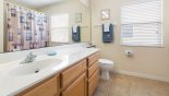 Family bathroom 3 shared between bedrooms 3, 4 & 5 with bath & shower over - www.iwantavilla.com is the best in Orlando vacation Villa rentals