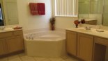 Spacious rental Highlands Reserve Villa in Orlando complete with stunning Master 1 bathroom  ensuite with corner bath, walk-in shower and his 'n' hers sinks either side