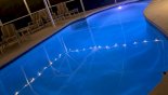Pool at night with colour changing underwater lighting - www.iwantavilla.com is your first choice of Villa rentals in Orlando direct with owner