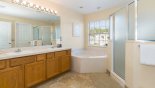 Spacious rental Highlands Reserve Villa in Orlando complete with stunning Master ensuite bathroom #1 with roman bath, walk-in shower, his & hers sinks & separate WC