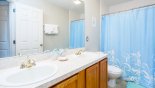 Villa rentals near Disney direct with owner, check out the Family bathroom #3 with bath & shower over, his & hers sinks and WC