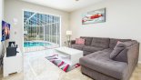 Family room with views & direct access onto pool deck - www.iwantavilla.com is the best in Orlando vacation Villa rentals