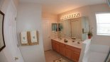 Ensuite bathroom with corner bath, large walk-in shower & his 'n' hers sinks - www.iwantavilla.com is the best in Orlando vacation Villa rentals