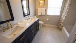 Beautiful modern family bathroom #3 with 2 sinks, WC & bath & shower over - www.iwantavilla.com is your first choice of Villa rentals in Orlando direct with owner