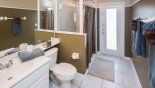 Pool bathroom adjacent to bedroom 2 with walk-in shower from Wellesley 5 Villa for rent in Orlando