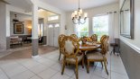 Spacious rental Highlands Reserve Villa in Orlando complete with stunning Dining area viewed towards entrance foyer and living room beyond