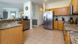 Fully fitted kitchen with quality appliances and granite counter tops - www.iwantavilla.com is the best in Orlando vacation Villa rentals