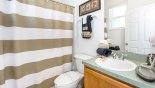 Bathroom #4 on ground floor with bath & shower over & access to pool deck with this Orlando Villa for rent direct from owner