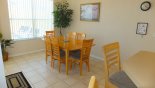 Dining area seating 6 with views onto pool deck from Jasmine 11 Villa for rent in Orlando