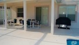 Villa rentals in Orlando, check out the Covered lanai providing welcome shade - note gas BBQ