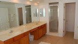 Villa rentals in Orlando, check out the Ensuite bathroom with his 'n' hers sinks, large walk-in shower, large corner bath & separate WC