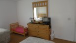 Bedroom 3 with toddler bed, full sized dresser & cable TV from Highlands Reserve rental Villa direct from owner