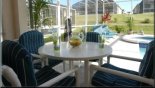 Covered lanai with patio table & 4 chairs - www.iwantavilla.com is the best in Orlando vacation Villa rentals
