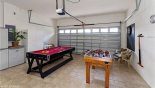 Games room with pool table and table foosball with this Orlando Villa for rent direct from owner