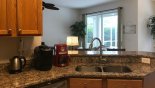 Kitchen viewed towards family room from Springtree 1 Villa for rent in Orlando