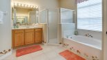 Villa rentals near Disney direct with owner, check out the Master 1 ensuite bathroom with Roman bath, his & hers sinks, large walk-in shower & separate WC