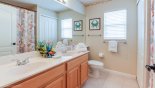 Family bathroom 3 with walk-in shower, WC & his 'n' hers sinks from Cambridge 11 Villa for rent in Orlando
