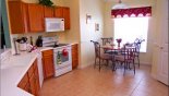 View of kitchen & breakfast nook seating 4 with this Orlando Villa for rent direct from owner