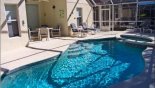 Spacious rental Highlands Reserve Villa in Orlando complete with stunning View of covered lanai area from pool