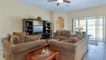 Villa rentals near Disney direct with owner, check out the Family room with ample seating to watch the 42'' LCD HD cable TV & DVD player