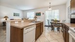 Fully fitted kitchen viewed towards breakfast nook - www.iwantavilla.com is the best in Orlando vacation Villa rentals