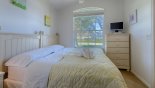 Villa rentals in Orlando, check out the Twin bedroom 5 configured as king sized bed & flat screen TV & DVD