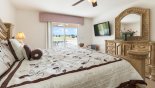 Villa rentals in Orlando, check out the Master bedroom with wall mounted 50
