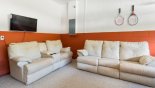 Villa rentals near Disney direct with owner, check out the Games room with comfortable sofas and wall mounted 32