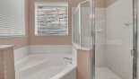 Master #1 ensuite bathroom with Roman bath, walk-in shower from Wynnewood 2 Villa for rent in Orlando