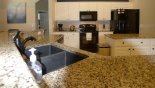 Fully fitted kitchen with quality appliances and granite counter tops - www.iwantavilla.com is the best in Orlando vacation Villa rentals