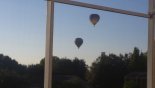 Hot air balloons are a regular sight from the pool - www.iwantavilla.com is the best in Orlando vacation Villa rentals