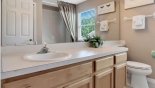 Family bathroom #3 with bath & shower over, single vanity sink & WC from Canterbury 3 Villa for rent in Orlando