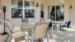 Covered lanai with 2 patio tables & 10 chairs - www.iwantavilla.com is the best in Orlando vacation Villa rentals