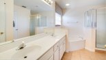 Master ensuite bathroom #2 with corner bath, walk-in shower, his & hers sinks & separate WC from Canterbury 4 Villa for rent in Orlando