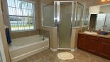 Master 1 ensuite bathroom with bath & large walk-in shower - www.iwantavilla.com is the best in Orlando vacation Villa rentals