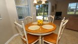 Breakfast nook seating 4 with views onto pool deck with this Orlando Villa for rent direct from owner