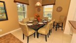Dining area seating 6 with great views onto pool deck from Eagle Bay 1 Villa for rent in Orlando